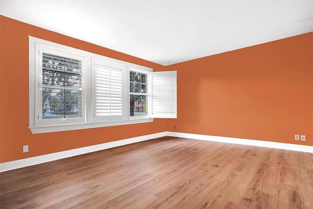 unfurnished room with light hardwood / wood-style floors