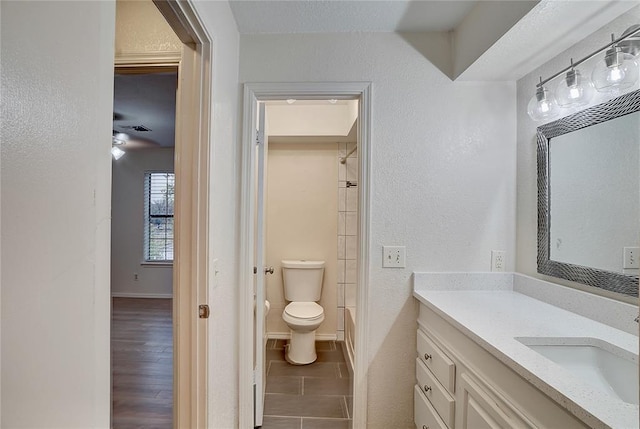 full bathroom with tile patterned floors, vanity, toilet, and shower / bathtub combination