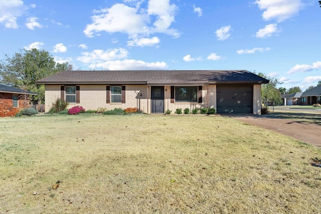 single story home featuring a front yard and a garage