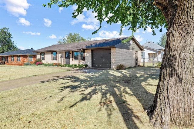 single story home featuring a garage and a front yard