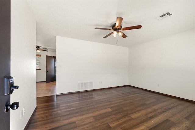 empty room featuring dark wood-type flooring