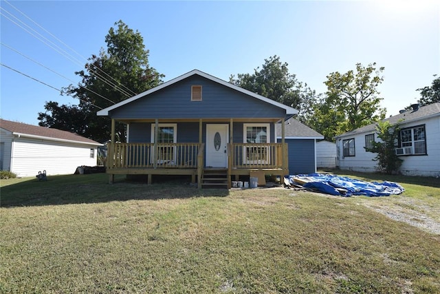 bungalow with a front lawn and covered porch