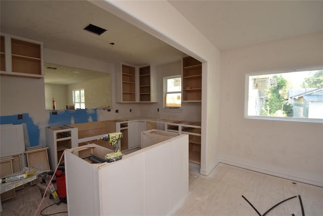 kitchen featuring white cabinets