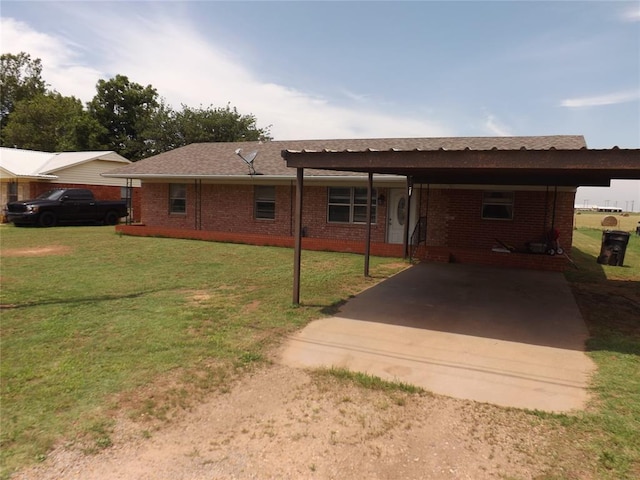 view of front facade with a front lawn and a carport