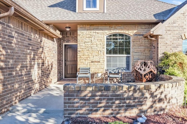 entrance to property with a patio