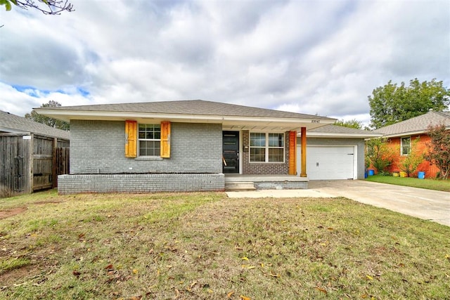 ranch-style home with a garage and a front yard