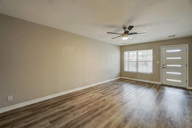 interior space with ceiling fan and hardwood / wood-style flooring