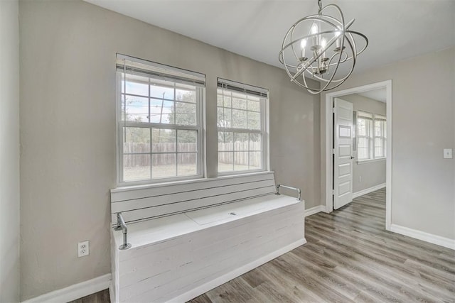 interior space with a chandelier and wood-type flooring