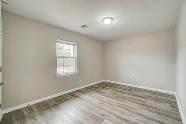 unfurnished room featuring light hardwood / wood-style floors