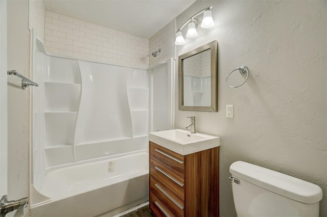 full bathroom featuring vanity, toilet, and  shower combination