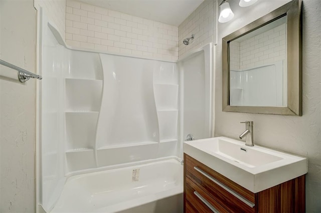 bathroom with vanity and tiled shower / bath combo