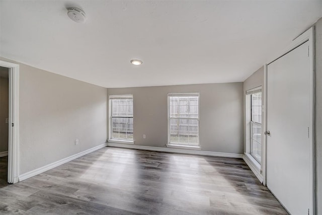 empty room with wood-type flooring