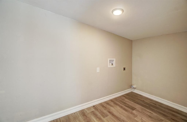 laundry area featuring hookup for an electric dryer, hardwood / wood-style floors, and washer hookup