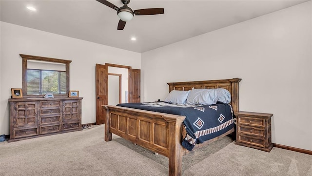 bedroom with ceiling fan and light colored carpet