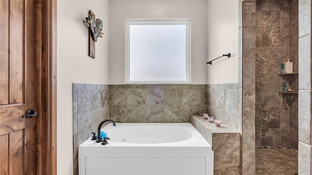 bathroom with shower with separate bathtub