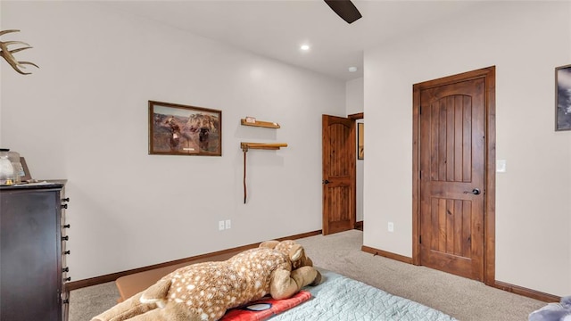 bedroom with ceiling fan and carpet floors