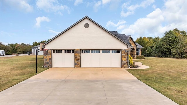 view of front of property featuring a garage and a front lawn