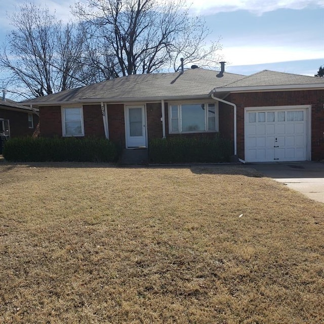 ranch-style home with a front lawn and a garage