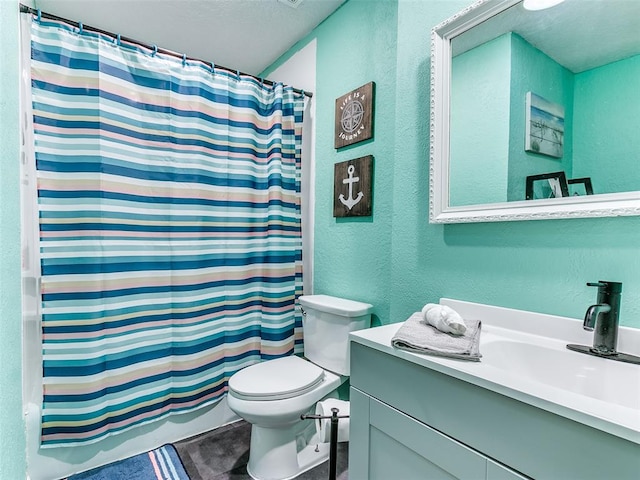 full bathroom featuring shower / bathtub combination with curtain, vanity, and toilet