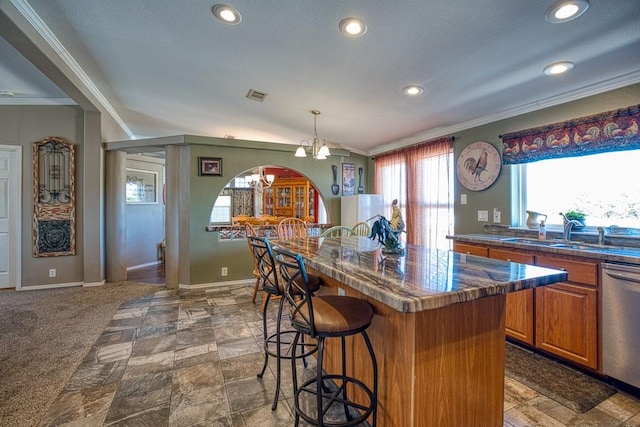 kitchen with a notable chandelier, dishwasher, crown molding, and sink