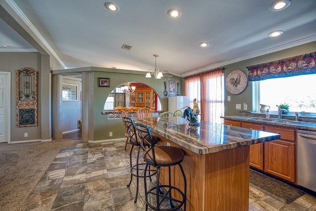 23880 State Highway 33, Kingfisher, OK 73750 - kitchen with a sink, stainless steel dishwasher, crown molding, a kitchen bar, and a chandelier