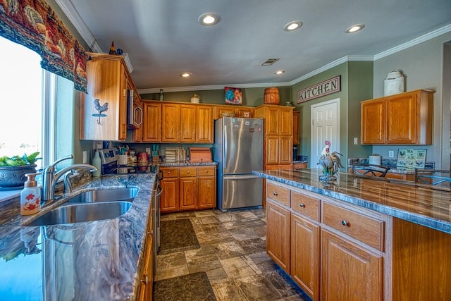 kitchen with crown molding, sink, and appliances with stainless steel finishes