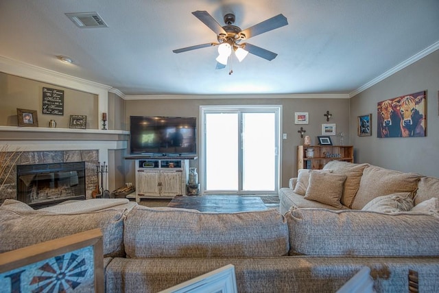 23880 State Highway 33, Kingfisher, OK 73750 - living room with crown molding, a ceiling fan, and a glass covered fireplace