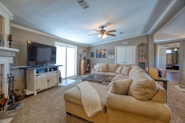 living room featuring carpet, crown molding, ceiling fan, and vaulted ceiling