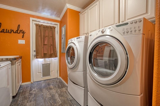 laundry area with crown molding, cabinets, separate washer and dryer, and dark wood-type flooring