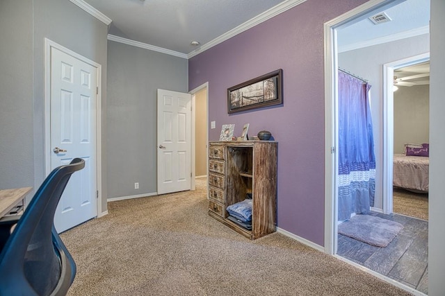 carpeted home office with ceiling fan and ornamental molding