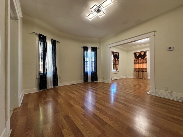 unfurnished room featuring wood-type flooring