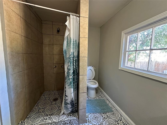 bathroom with tile patterned floors, toilet, and a shower with shower curtain