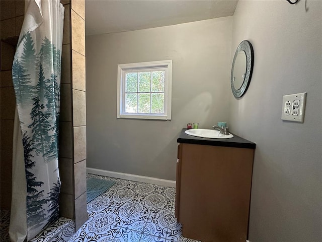 bathroom featuring tile patterned flooring, a shower with curtain, and vanity