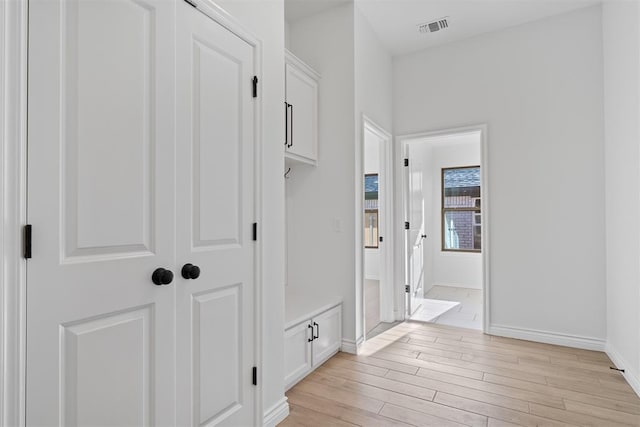 corridor featuring light hardwood / wood-style floors