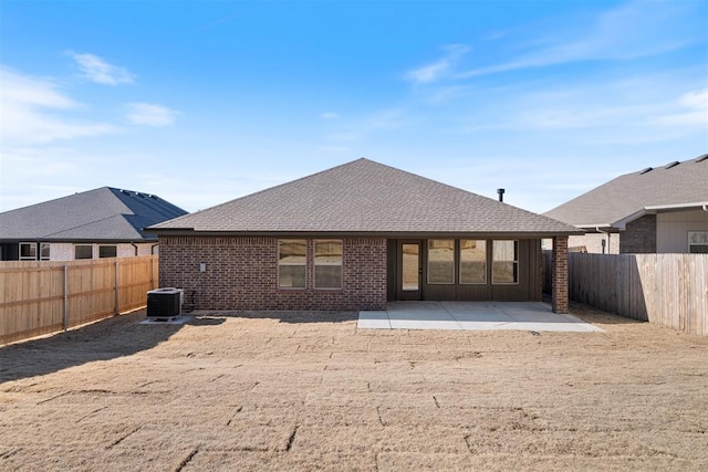 rear view of house featuring a patio and central AC