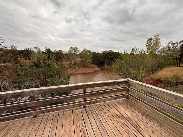 wooden deck with a water view