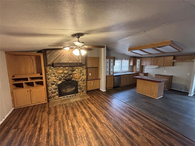 kitchen featuring a textured ceiling, dark hardwood / wood-style floors, and ceiling fan