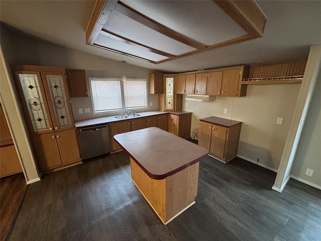 kitchen featuring vaulted ceiling, sink, dishwasher, dark hardwood / wood-style floors, and a kitchen island