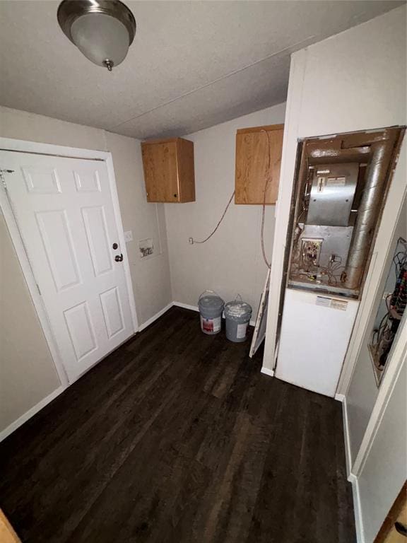 laundry room featuring dark wood-type flooring