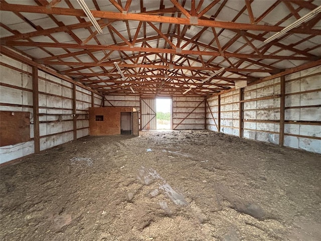 miscellaneous room with lofted ceiling