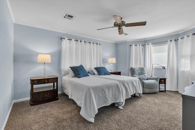 carpeted bedroom featuring ceiling fan and crown molding