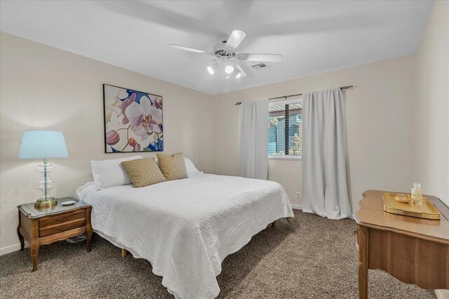 bedroom featuring ceiling fan and carpet floors