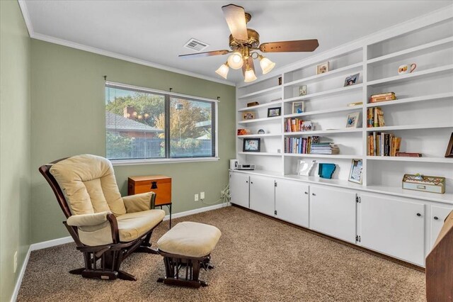 living area featuring light carpet, ceiling fan, and crown molding