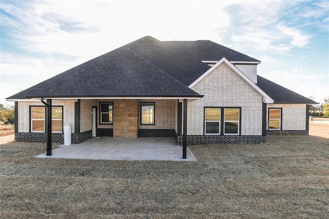 back of property featuring a patio area