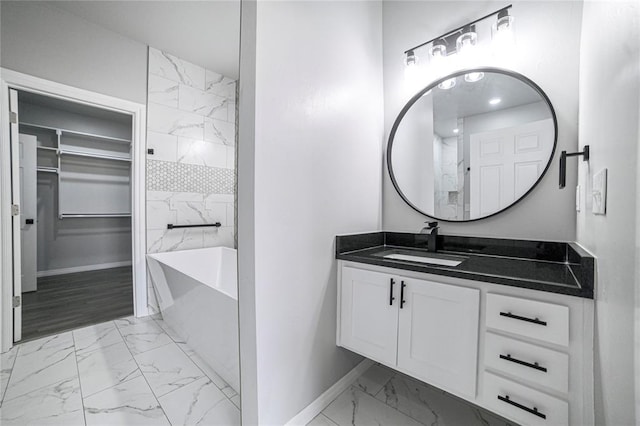 bathroom with a bath and vanity