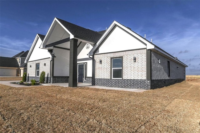 view of property exterior featuring a lawn