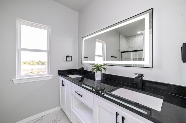 bathroom with vanity, an enclosed shower, and a wealth of natural light