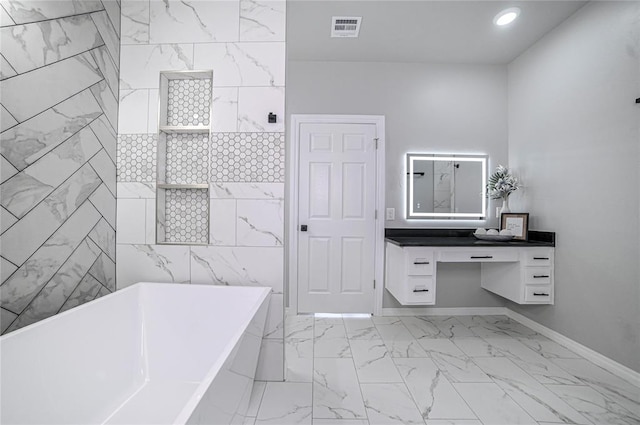 bathroom featuring vanity, a tub, and tile walls