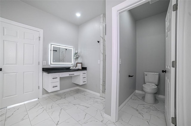 bathroom with vanity and toilet