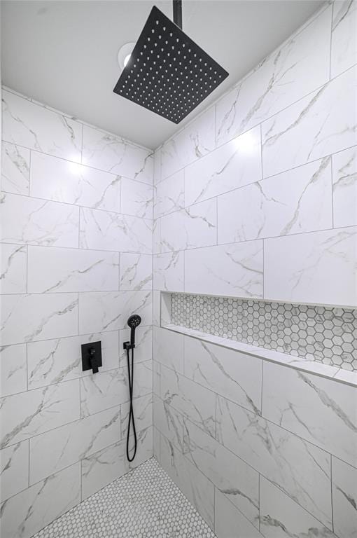 bathroom with tiled shower